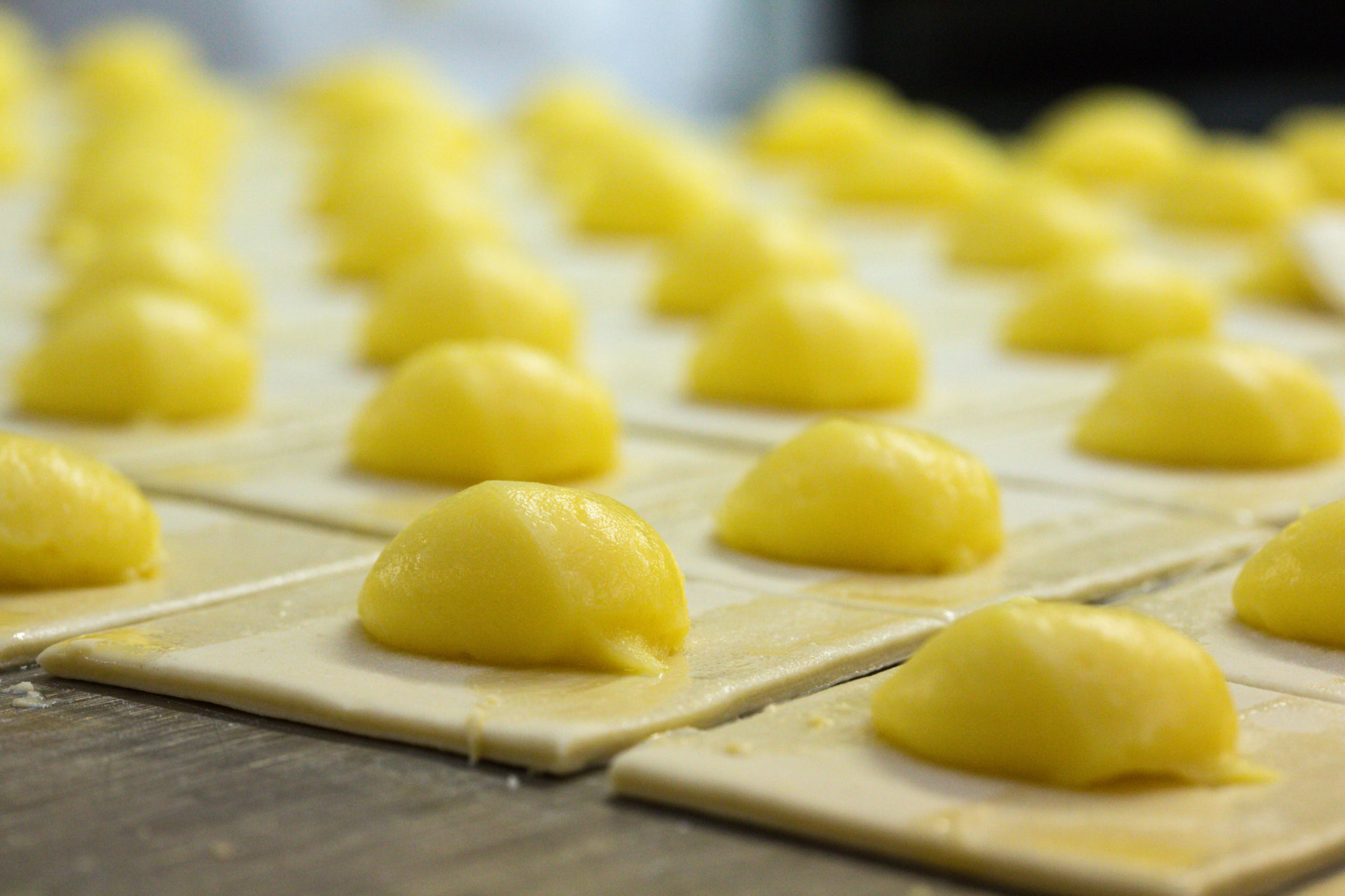 Custard Pastries being prepared for baking